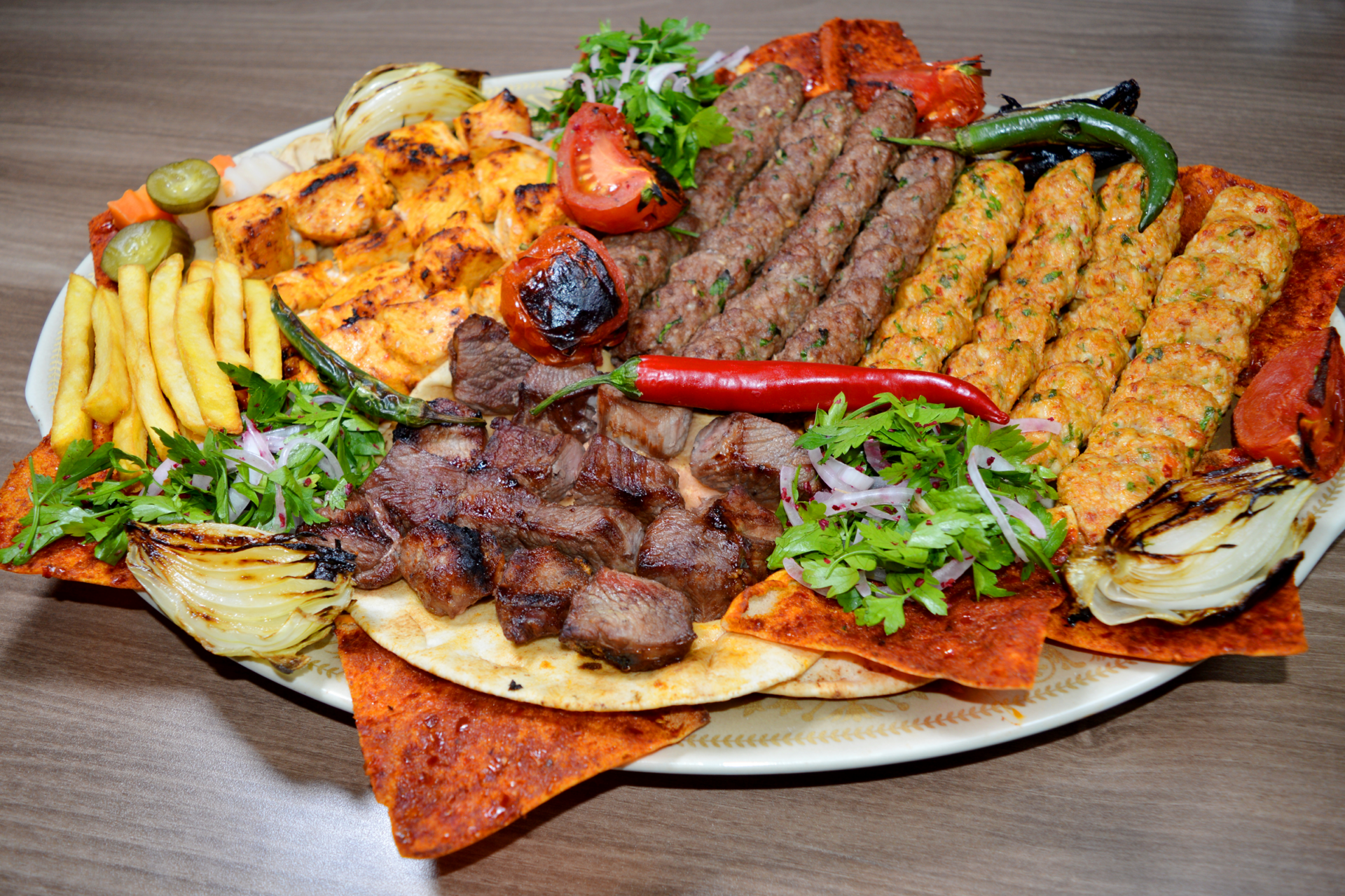 Assorted meats and sides on a plate