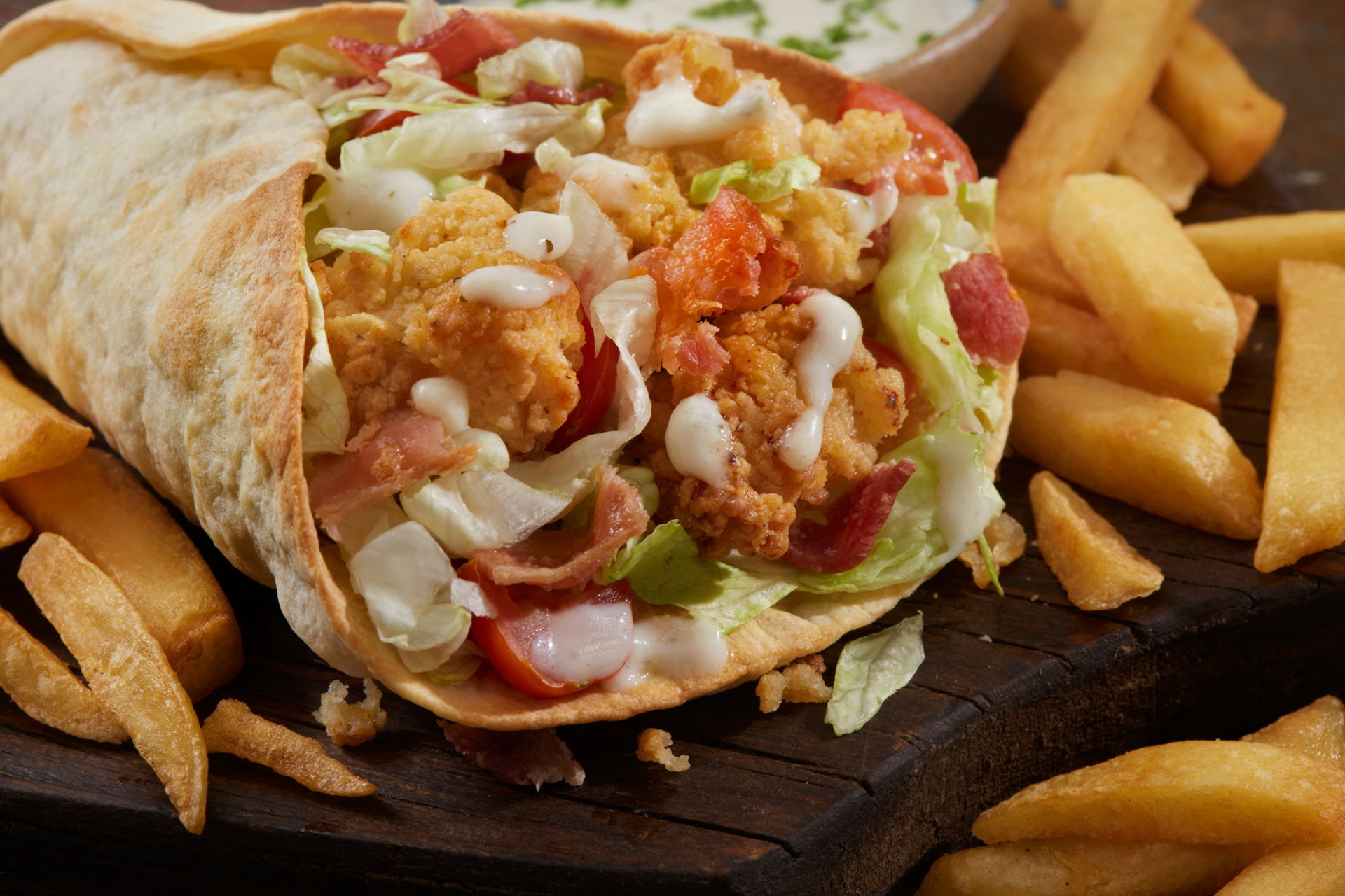 Tasty wrap with salad and fries